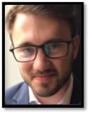The image contains a picture of Thomas E. Randall.