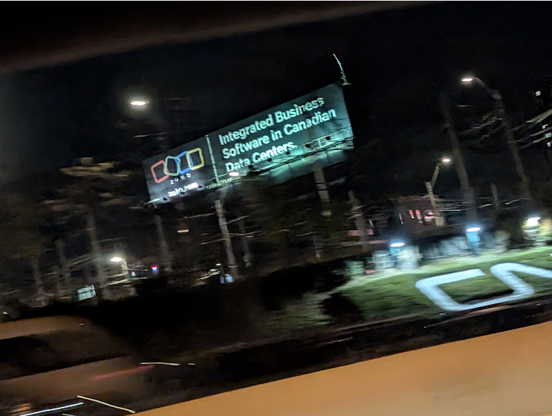 A Zoho billboard that says 'Integrated Business Software in Canadian Data Centers'><span id=